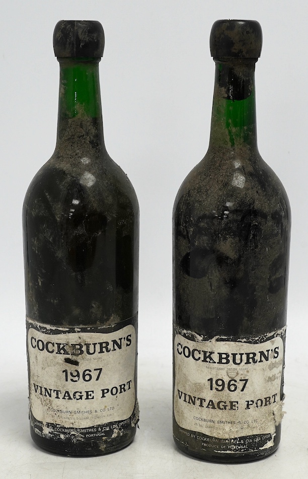Two bottles of Cockburn's 1967 vintage port. Condition - levels good, capsules sound and labels worn.